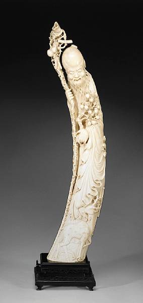 Appraisal: A Chinese carved ivory immortal of Shoulao with deer The