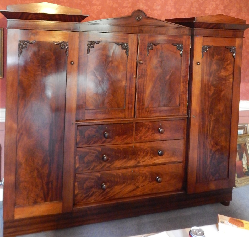 Appraisal: An early Victorian mahogany inverted breakfront wardrobe with a moulded