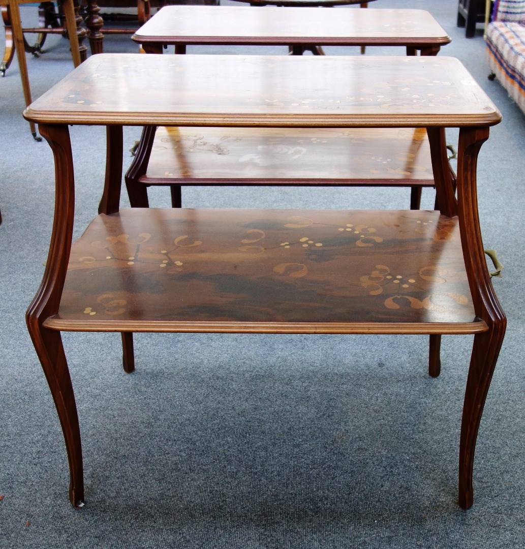 Appraisal: A matched pair of marquetry inlaid two tier tables by