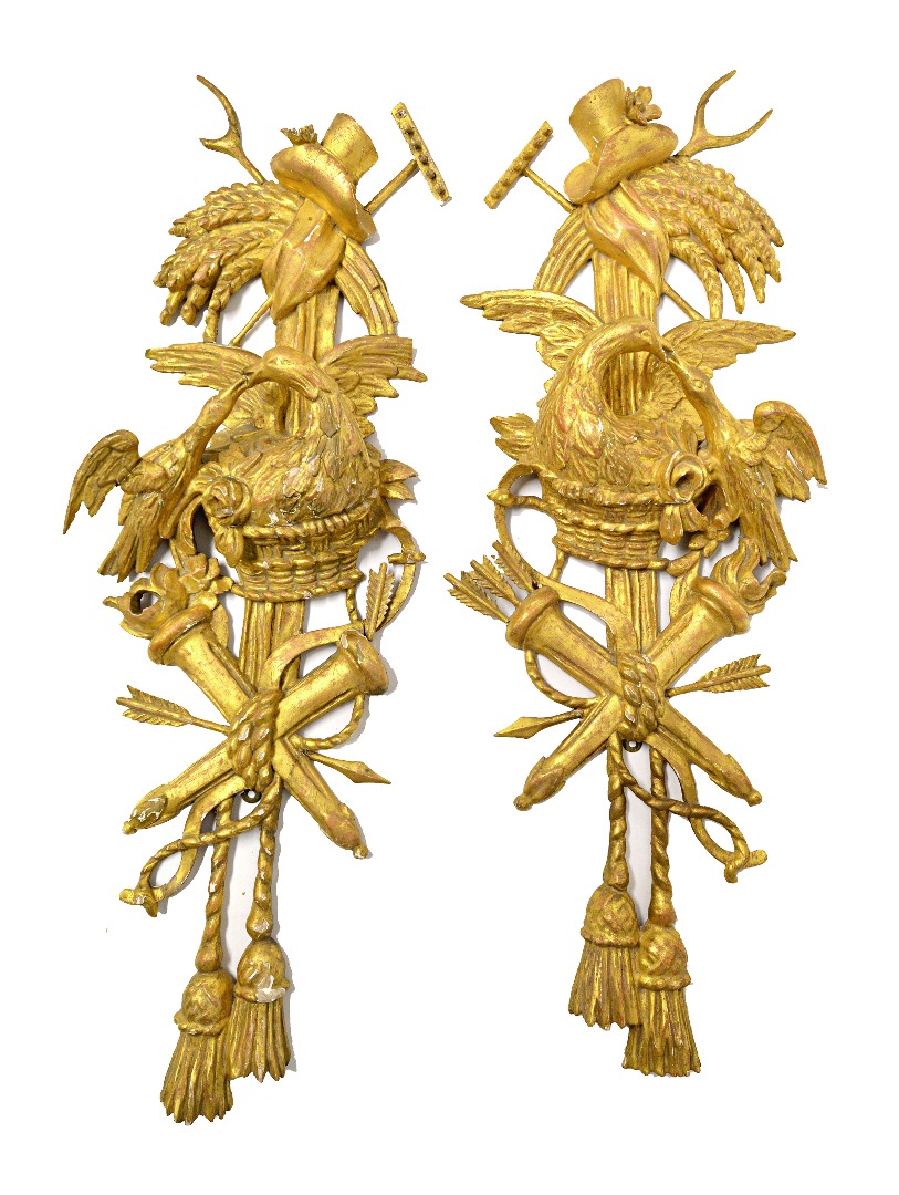 Appraisal: A pair of giltwood wall appliques th century carved with