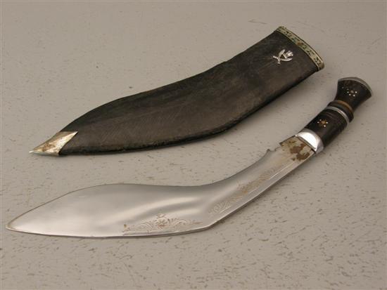 Appraisal: Gurkha horn handled Kukri in leather sheath enclosing two small