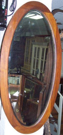 Appraisal: An Edwardian mahogany oval mirror cm x cm x