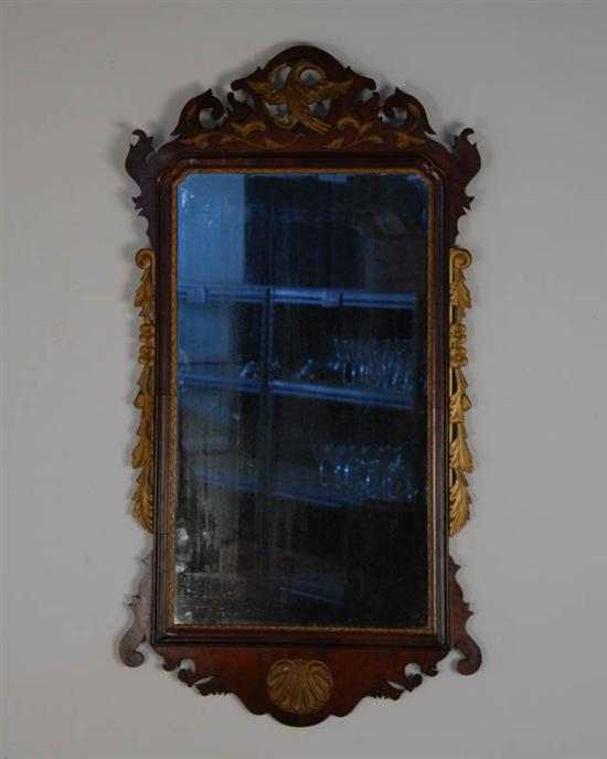 Appraisal: A Chippendale-style Wall Mirror having a mahogany frame with carved