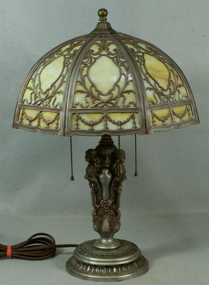 Appraisal: panel caramel and green slag glass paneled table lamp figural