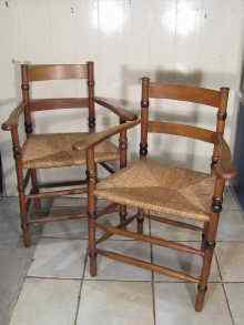 Appraisal: A pair of Arts and Crafts beechwood armchairs with rush