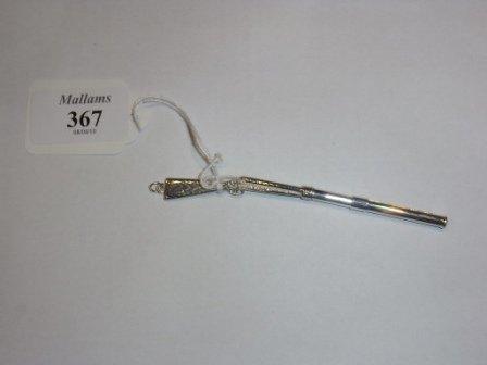 Appraisal: A SILVER TOOTHPICK in the form of a shotgun long