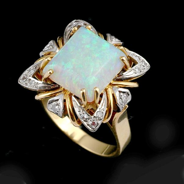 Appraisal: A SOLID WHITE OPAL AND DIAMOND RING The square solid