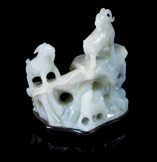 Appraisal: A White Jade Carving of Three Rams Height inches A