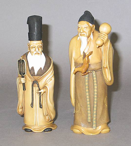 Appraisal: Two stained ivory figural okimono The first depicting the elder