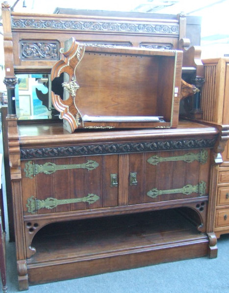 Appraisal: A mid Victorian oak sideboard the ledge back with carved