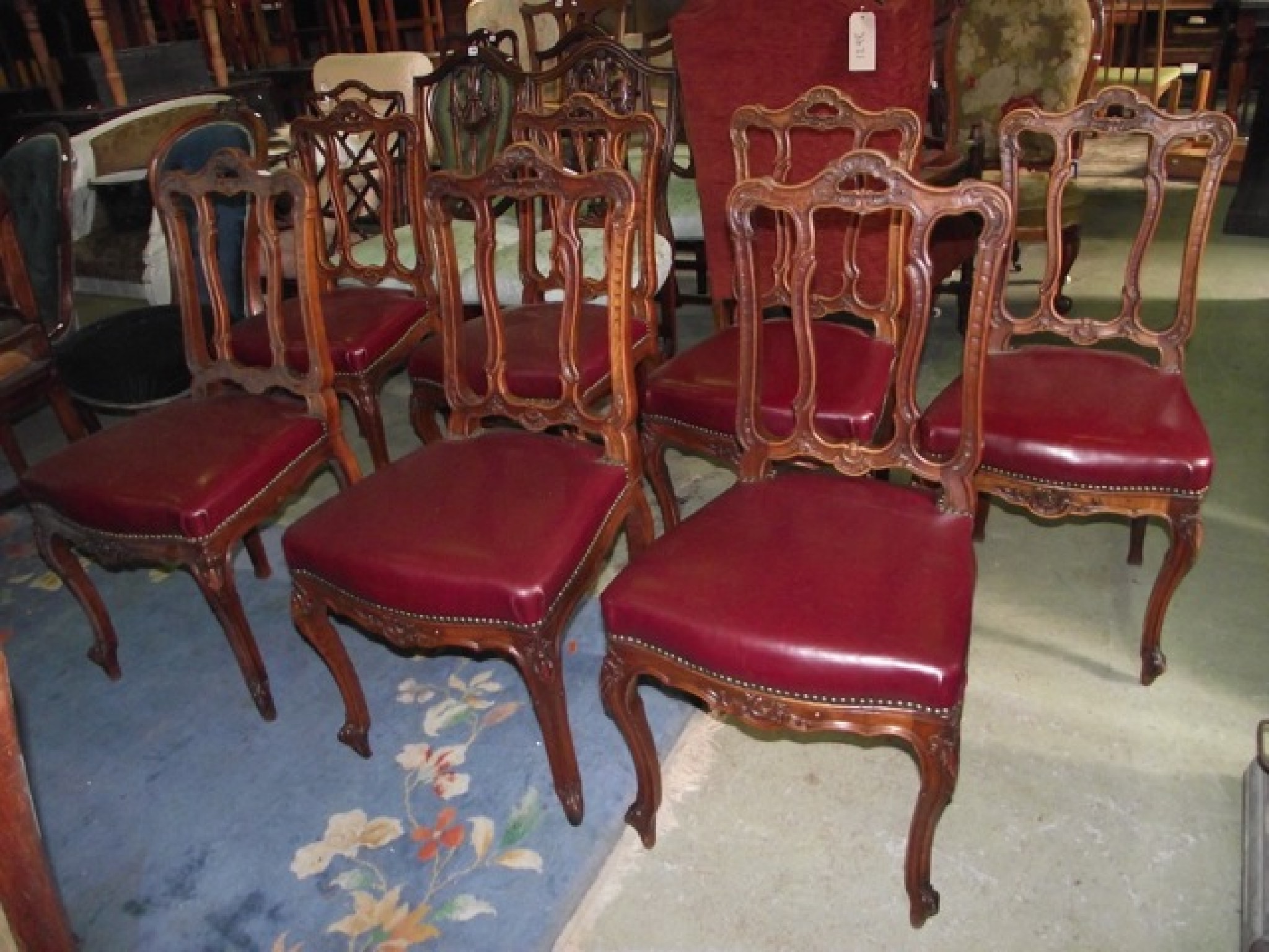 Appraisal: A set of seven th century walnut framed dining chairs