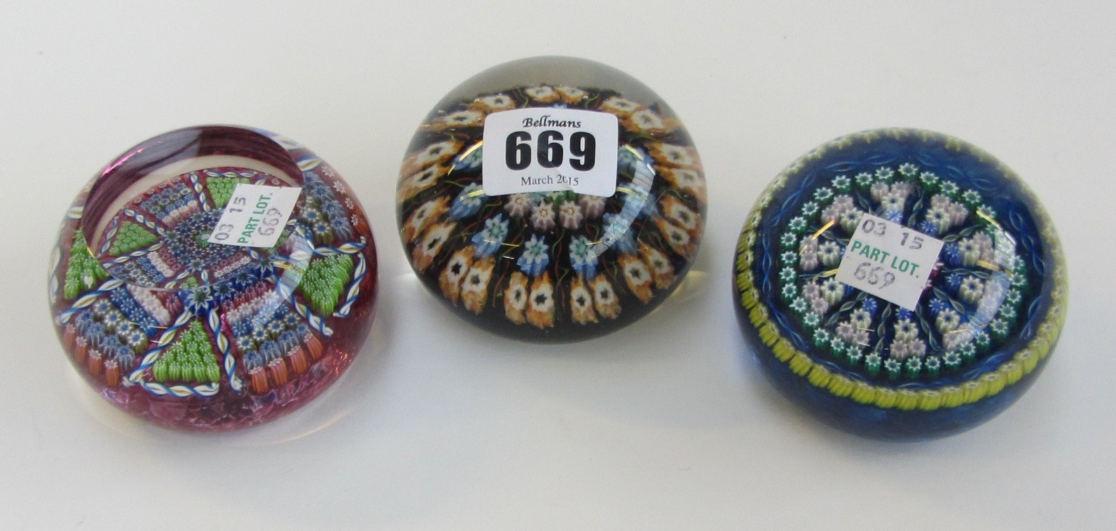 Appraisal: Three Perthshire glass paper weights circa each with millefiori cane