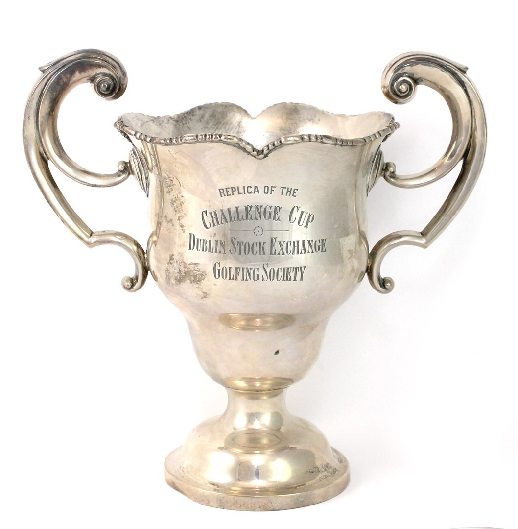 Appraisal: An Irish silver twin handled trophy cup detailed Replica of