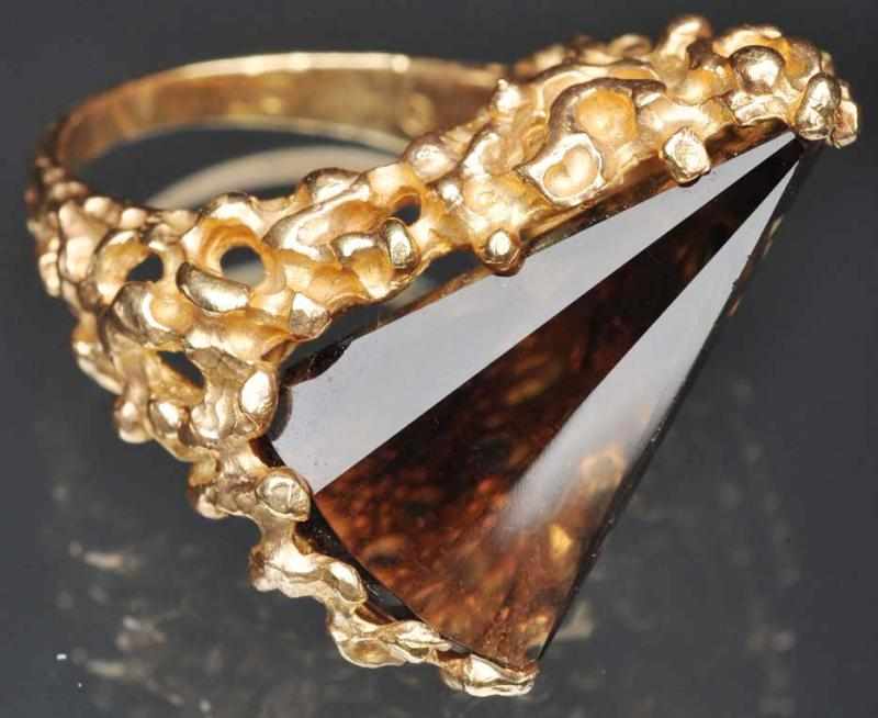 Appraisal: K Y Gold Ring with Smokey Topaz Unusual cut Weight