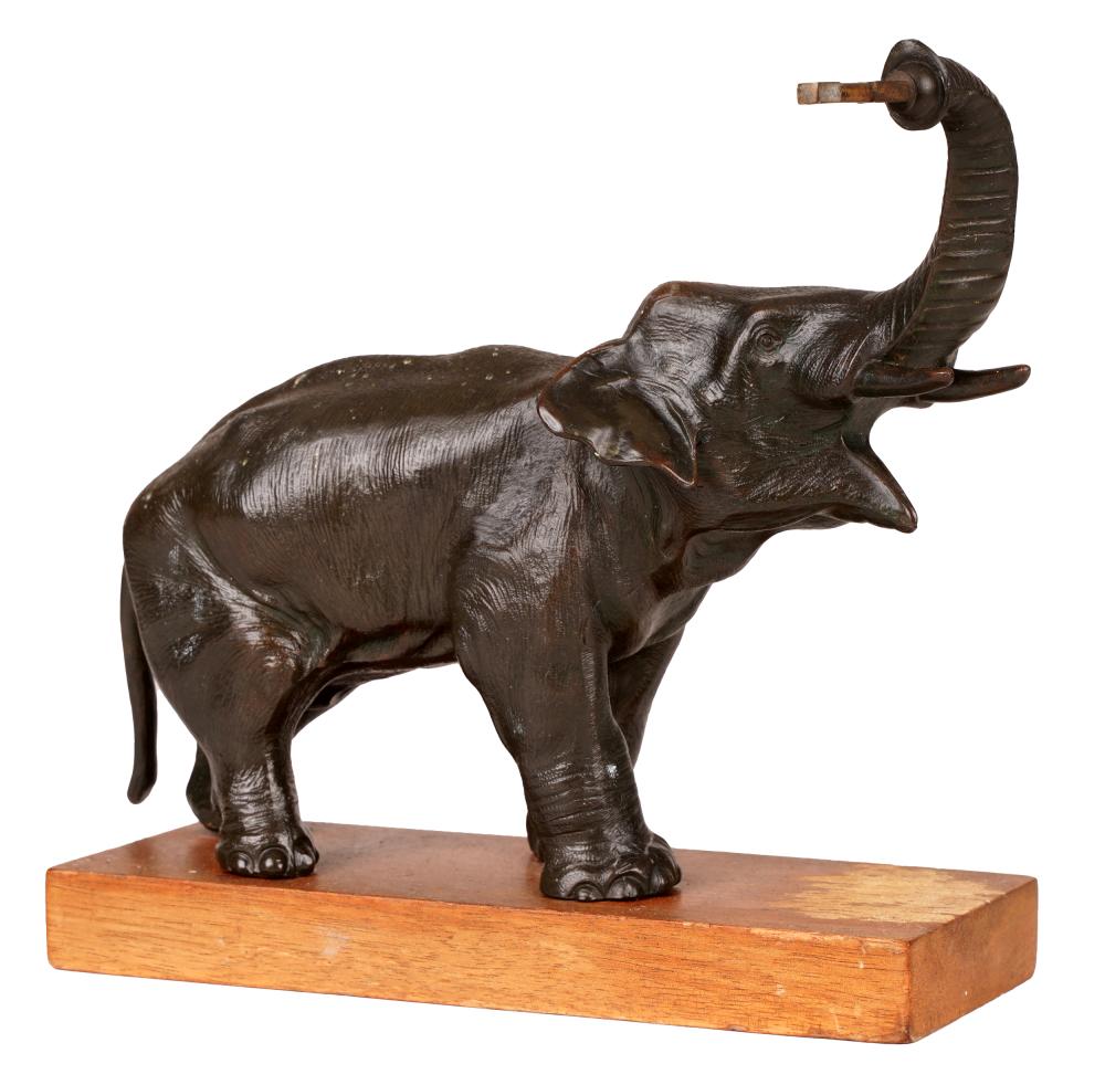 Appraisal: PATINATED BRONZE FIGURE OF AN ELEPHANTmounted on a wood base