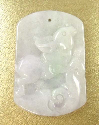 Appraisal: CHINESE CARVED JADE PENDANT lavender and green jade carving of