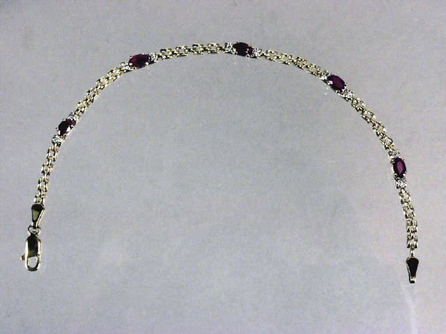 Appraisal: Ladies karat yellow gold oval ruby and diamond bracelet Retail