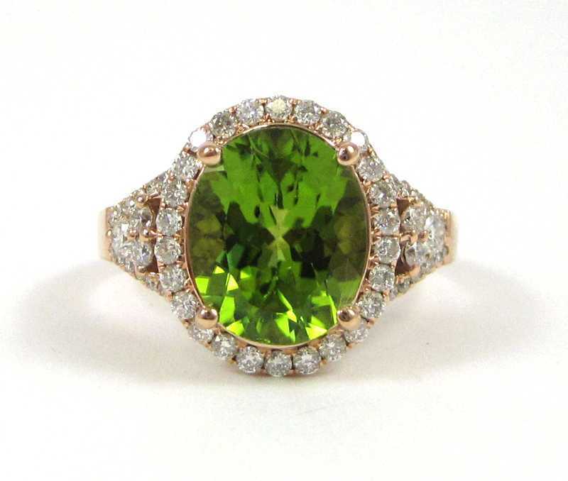 Appraisal: PERIDOT DIAMOND AND FOURTEEN KARAT GOLD RING The rose gold