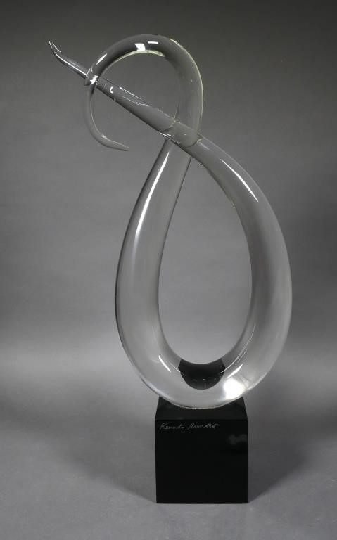 Appraisal: Abstract clear glass loop sculpture on a black base Base