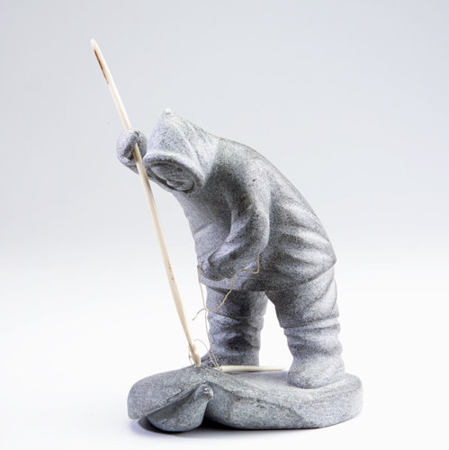 Appraisal: Nunavik Inuit mottled grey soapstone figure of a hunter and