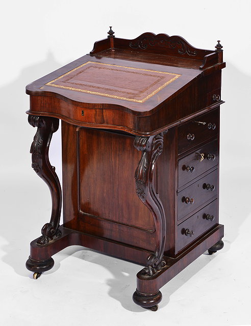 Appraisal: A LATE VICTORIAN ROSEWOOD DAVENPORT BROWN LEATHER INSET DESK the