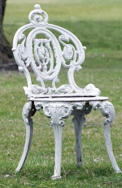 Appraisal: PAIR OF CAST IRON VICTORIAN SIDE CHAIRS Marked Atlanta Stove