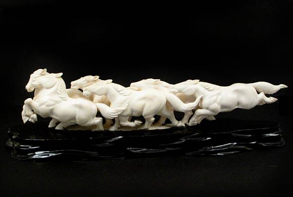 Appraisal: A carved Chinese ivory horse group height in width in