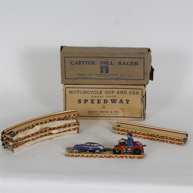 Appraisal: Group of tin windup toys with track Includes Tin windup