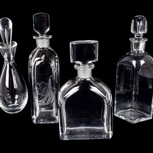 Appraisal: Four Glass Decanters Comprising a Baccarat diamond-form decanter a Steuben