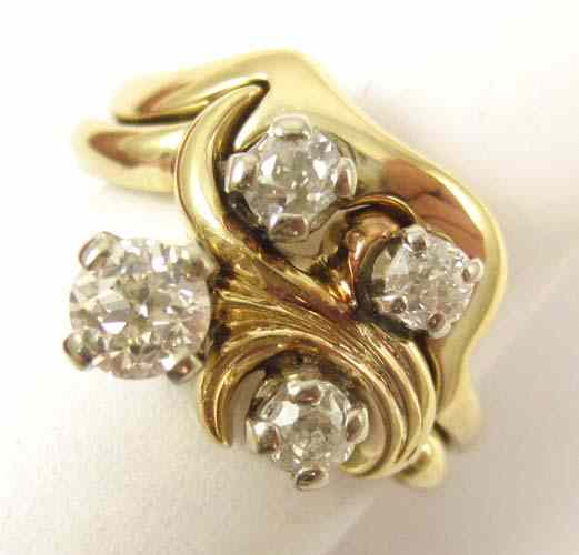 Appraisal: DIAMOND AND FOURTEEN KARAT GOLD RING set with four round-cut