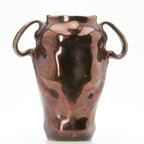 Appraisal: OWENS Feroza Two-handled vase covered in a red lustered glaze