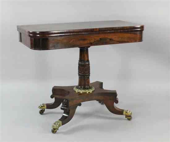 Appraisal: A William IV brass mounted rosewood card table with carved