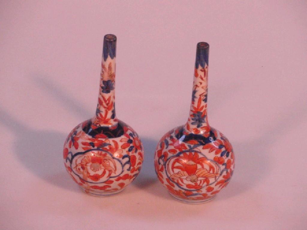 Appraisal: A pair of thC Chinese bottle vases painted with flowers