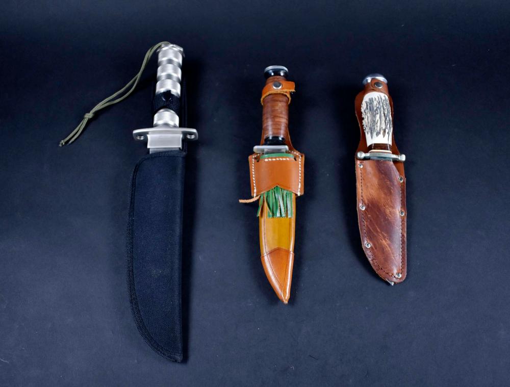 Appraisal: THREE VARIED HUNTING KNIVESModern With stainless steel blades with wood