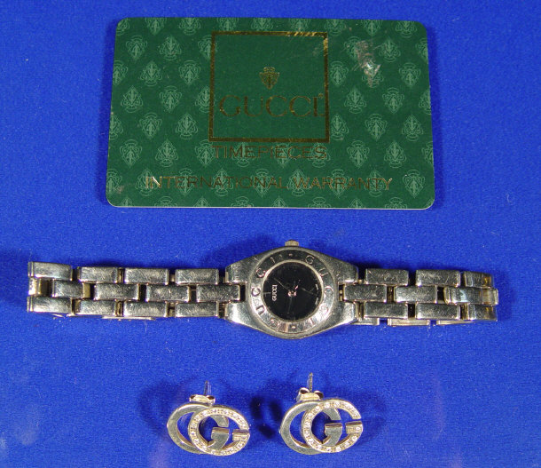 Appraisal: Gucci wristwatch together with a pair of Gucci diamond earrings