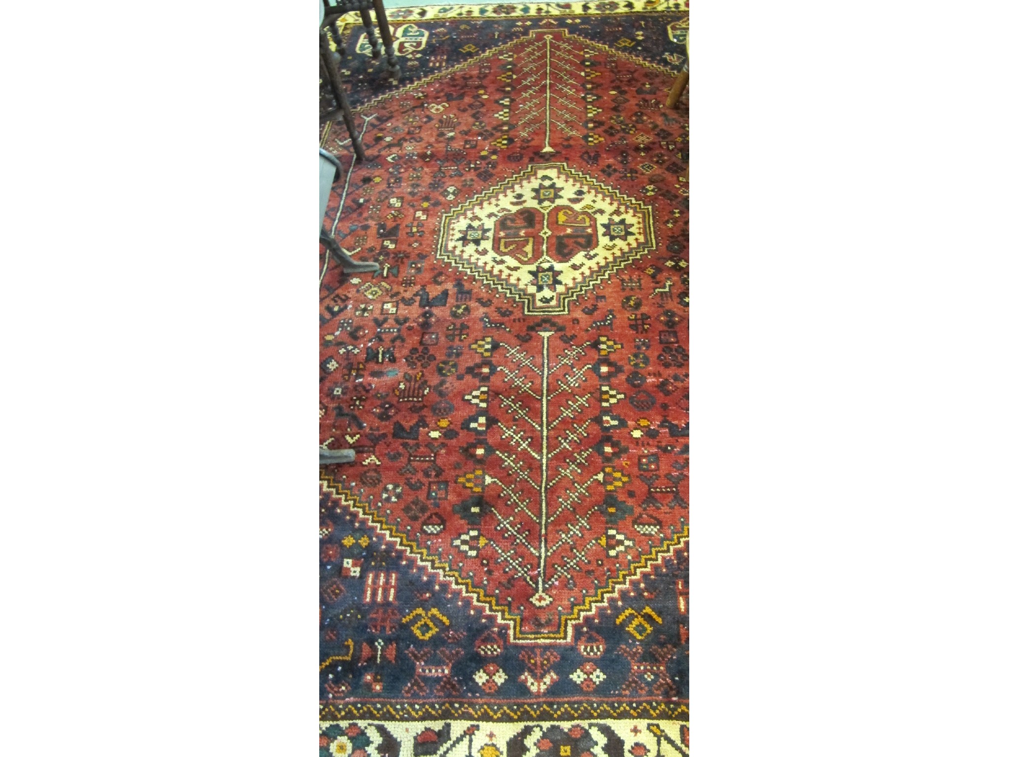 Appraisal: A Persian Shiraz red ground rug x cm