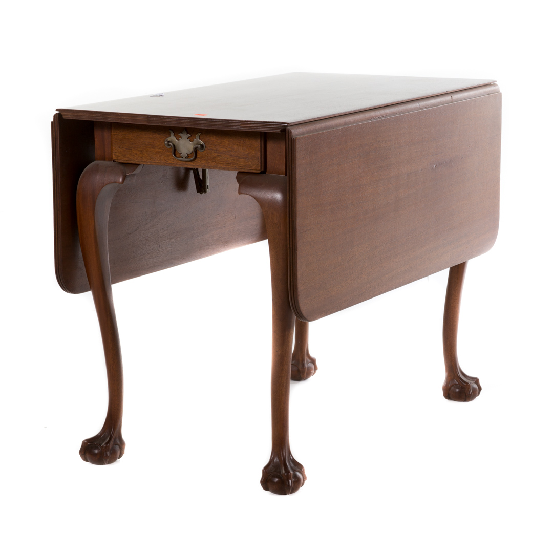 Appraisal: Chippendale style mahogany drop leaf table with single drawer in