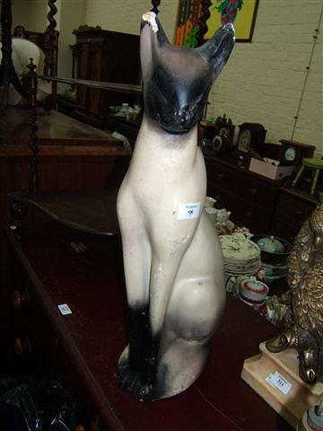 Appraisal: A painted plaster sculpture of a Siamese cat high