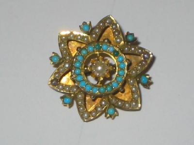 Appraisal: A VICTORIAN TURQUOISE AND SEED PEARL BROOCH modelled as an