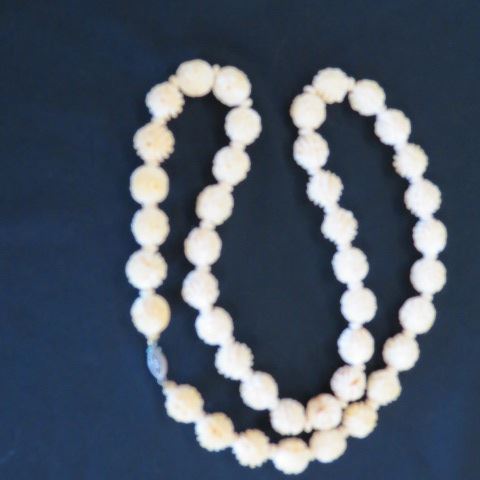 Appraisal: Carved Ivory Bead Necklace floral style diameter beads long circa