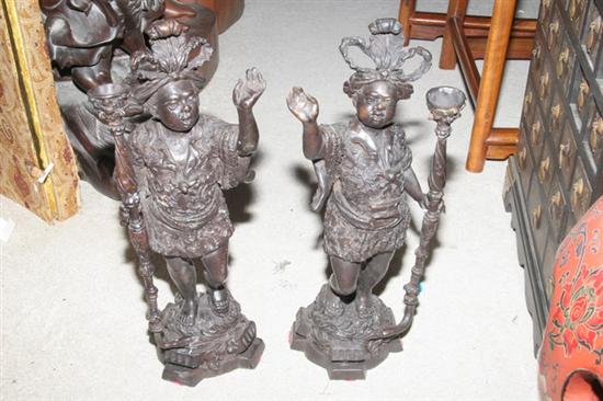 Appraisal: PAIR BRONZE FIGURE OF MEN Wearing feather headress - in