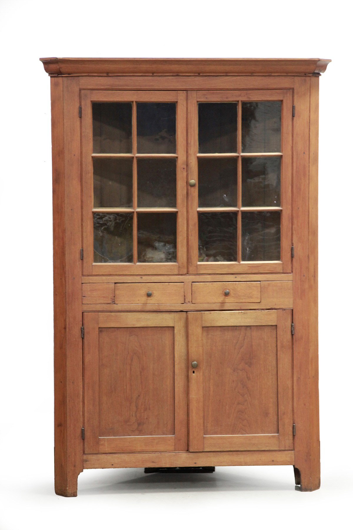 Appraisal: COUNTRY ONE-PIECE CORNER CUPBOARD American mid th century Butternut with