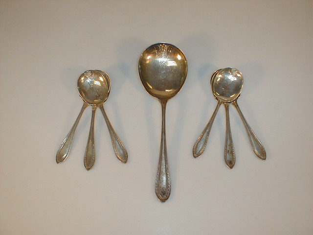 Appraisal: A set of silver Coupe spoons and matching serving spoon