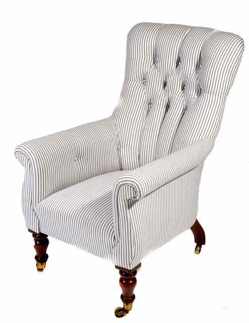 Appraisal: AN EARLY VICTORIAN LIBRARY CHAIR with scroll arms and button