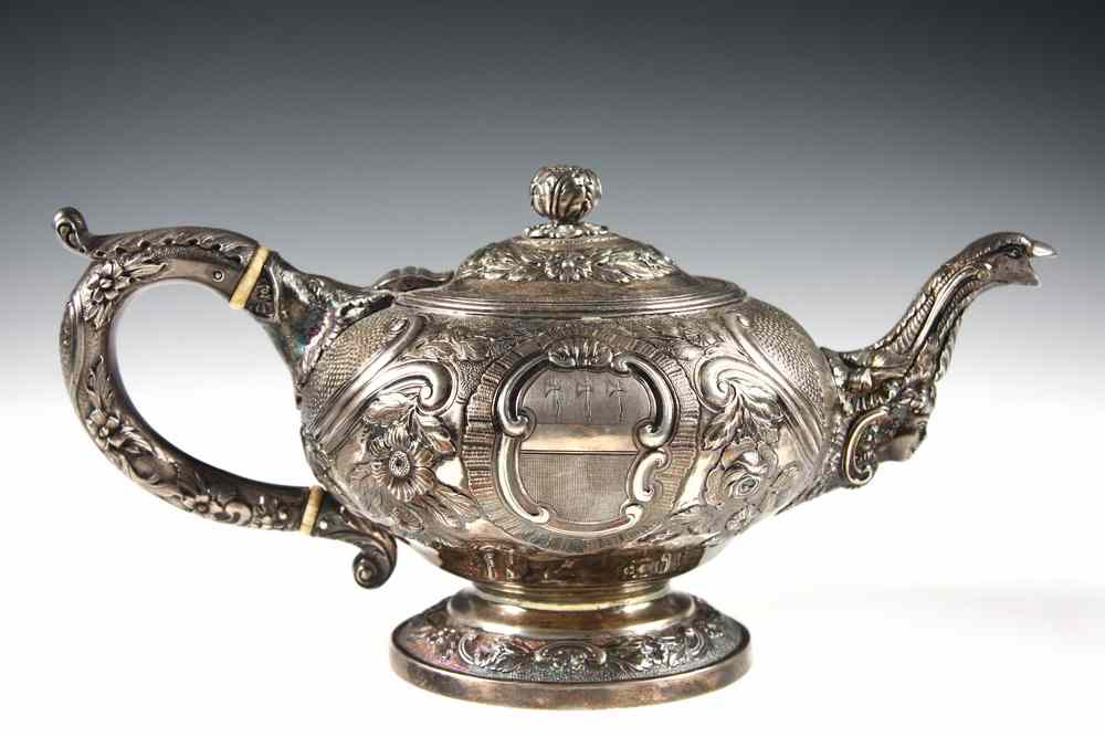 Appraisal: ENGLISH STERLING SILVER TEAPOT - Repoussed and Hand Chased Squatty