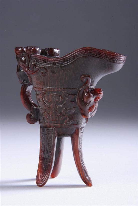 Appraisal: CHINESE RHINOCEROS HORN LIBATION CUP Sides carved with band of