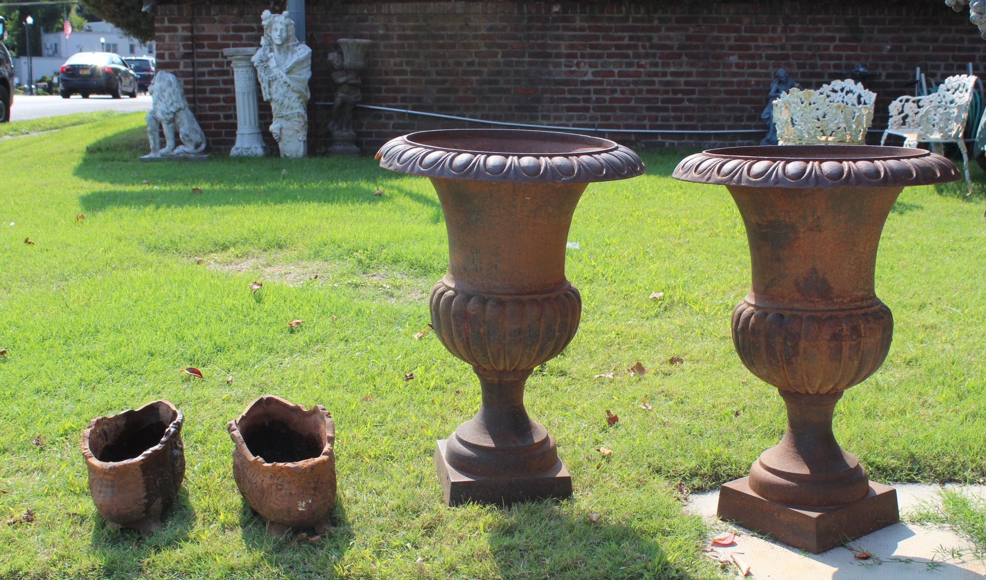 Appraisal: VINTAGE PAIRS OF CAST IRON URNS Pair of pedestal urns