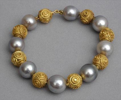 Appraisal: PEARL BRACELET Strand of grey baroque pearls alternated with hollow