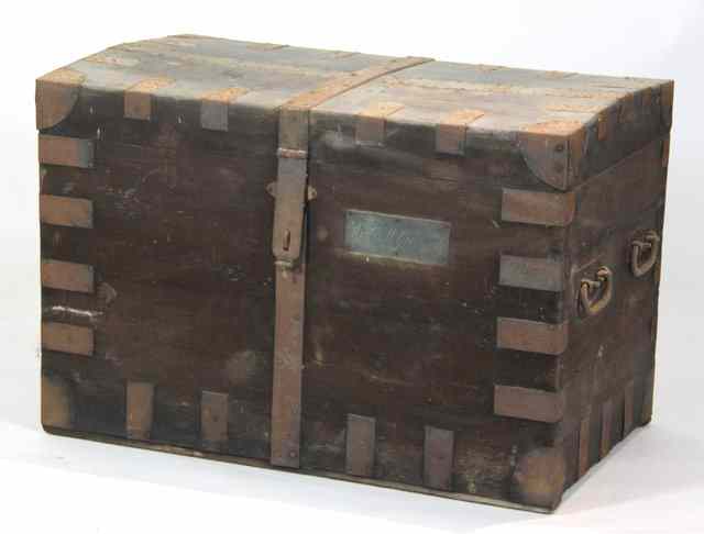 Appraisal: A metal bound silver chest with two carry handles to