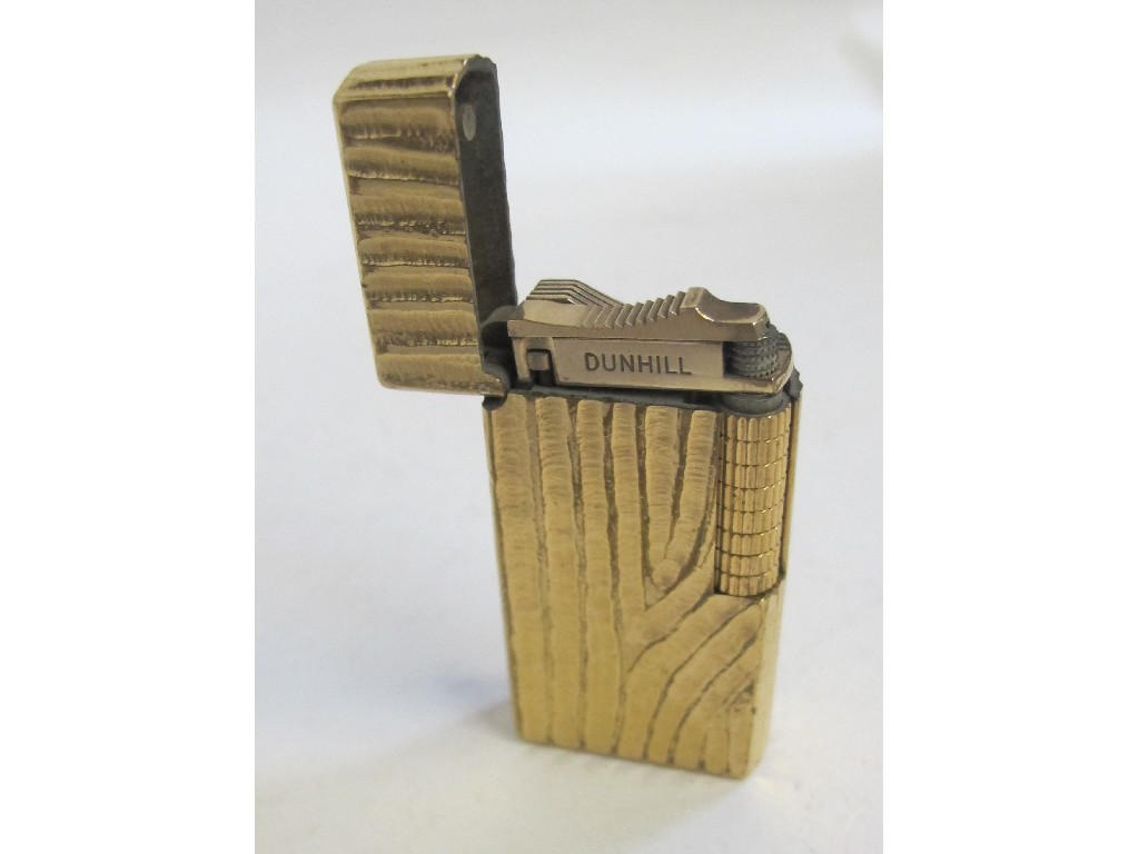 Appraisal: Gilt metal bark effect cigarette lighter by Dunhill